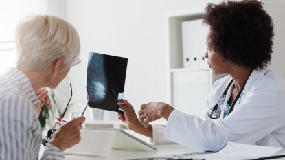 mature woman at a breast cancer screening with her doctor