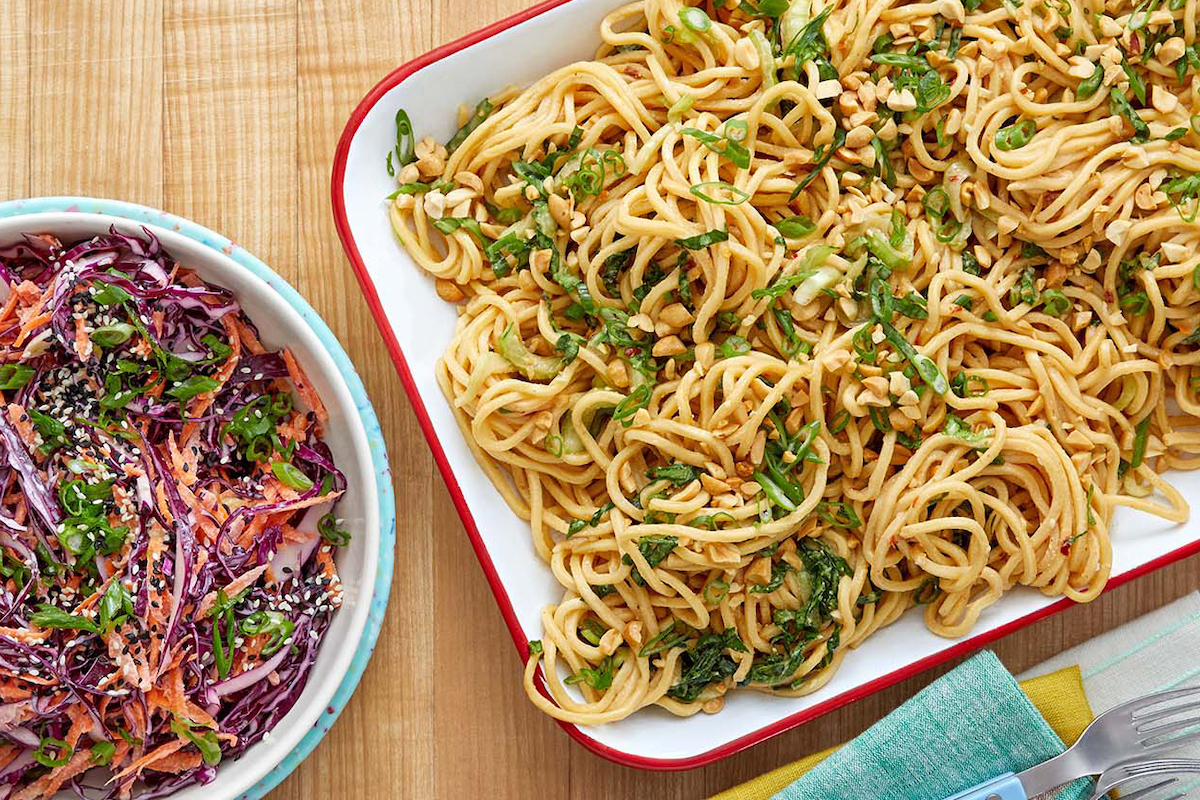 Noodles and cabbage slaw on counter