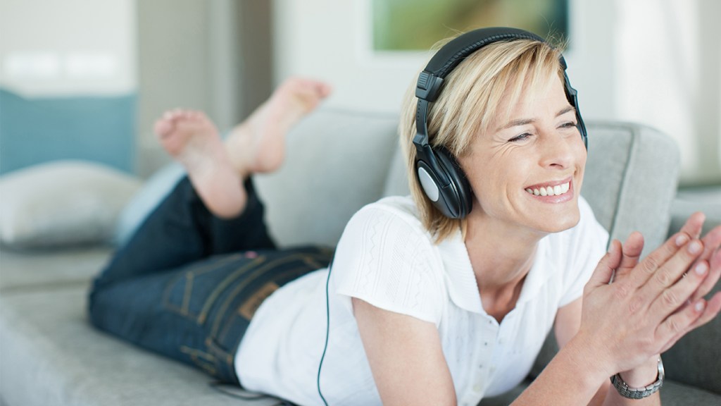 woman in headphones enjoying music (velvet bean benefits)