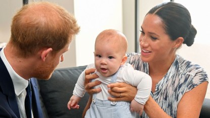 Prince Harry and Meghan Duchess of Sussex, holding their son Archie
