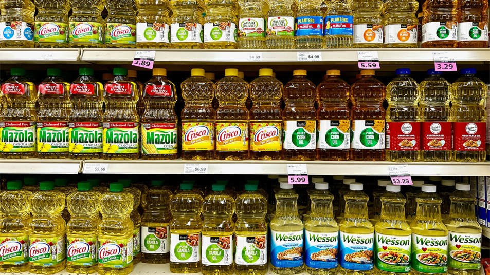 grocery store shelf with various oils