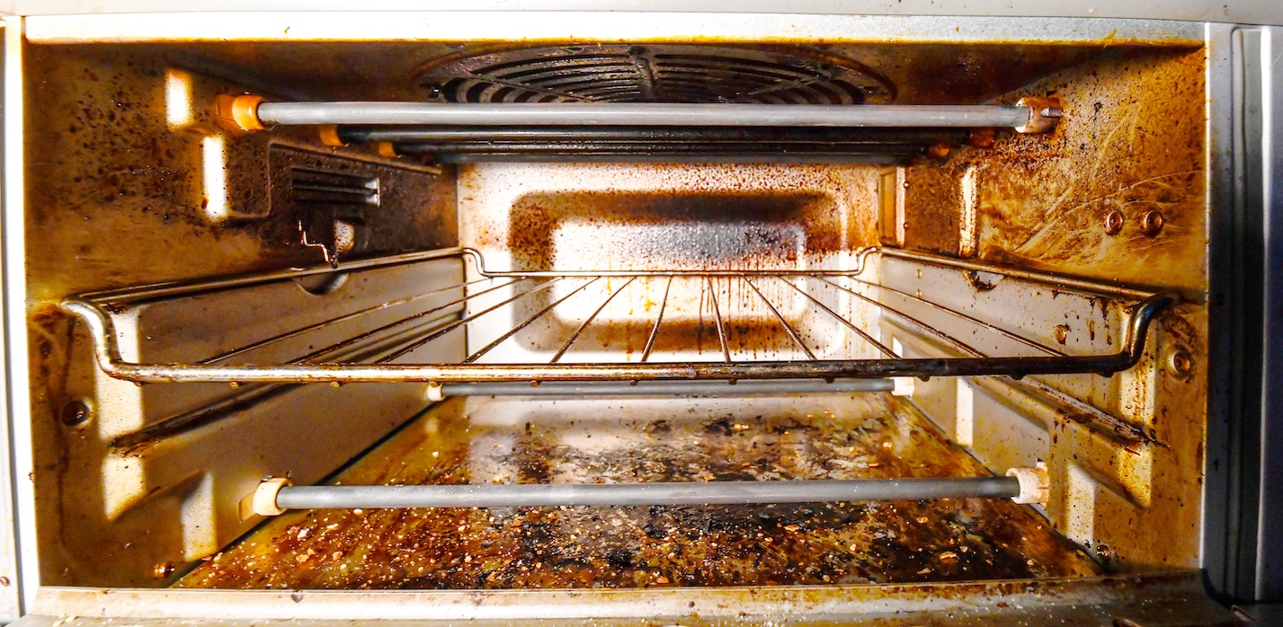 inside of a dirty toaster oven