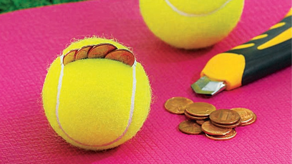 Tennis ball filled with pennies to create hand weights