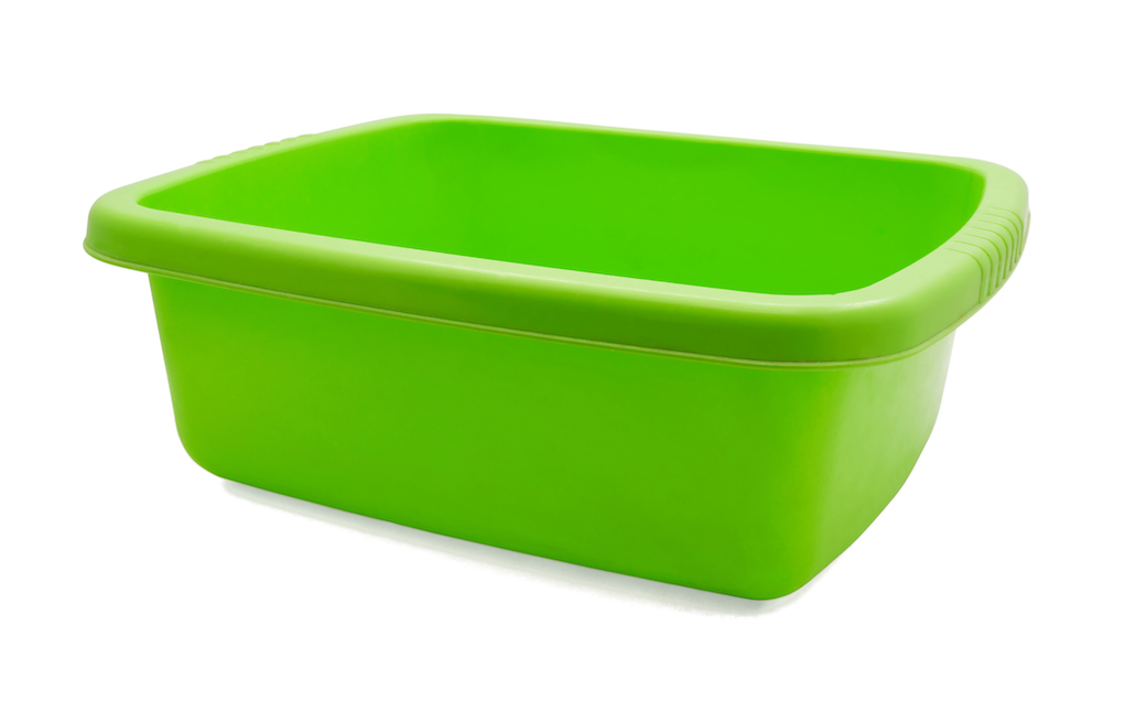Green plastic dish pan for washing a baseball cap