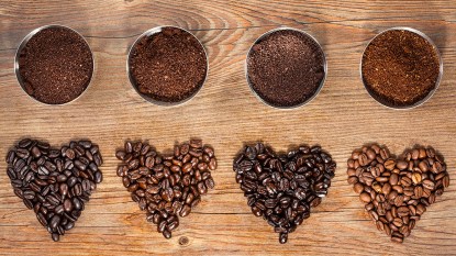 Four different kinds of roasted coffee beans, including light roast which makes for a weight loss coffee