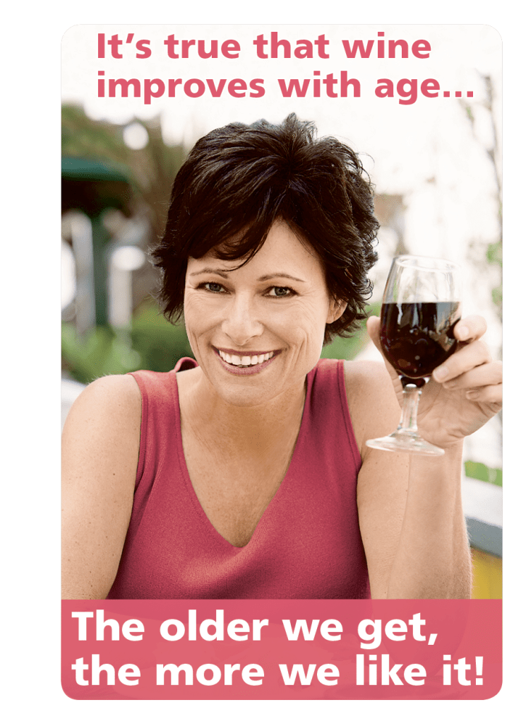 A women smiles with red wine after reading wine jokes and learning how both women and wine get better with age 