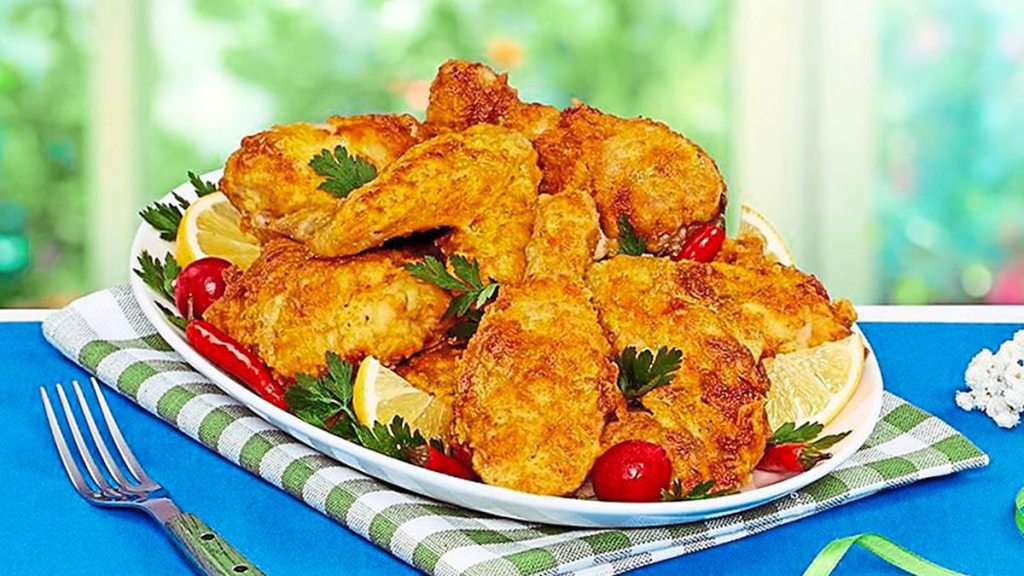 A bowl of Southern Fried Chicken sits on a table