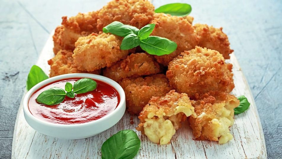 Mac ‘n’ Cheese Bites sit on a plate waiting to be eaten