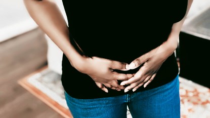 black woman suffering from fibroid pain