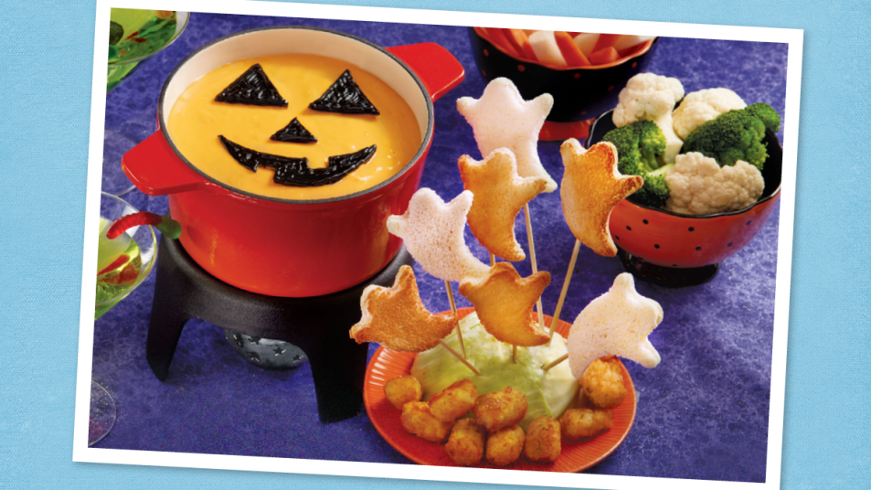 Jack-o’-Lantern Fondue sits on a plate (halloween potluck)