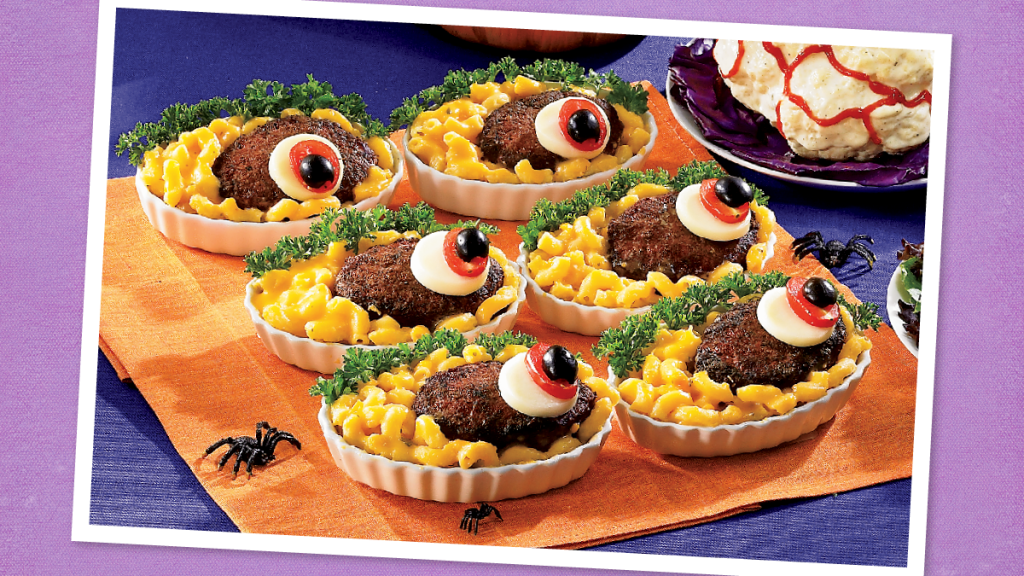 Meaty and Macabre Mac ’n’ Cheese sits looking spooky (halloween potluck)