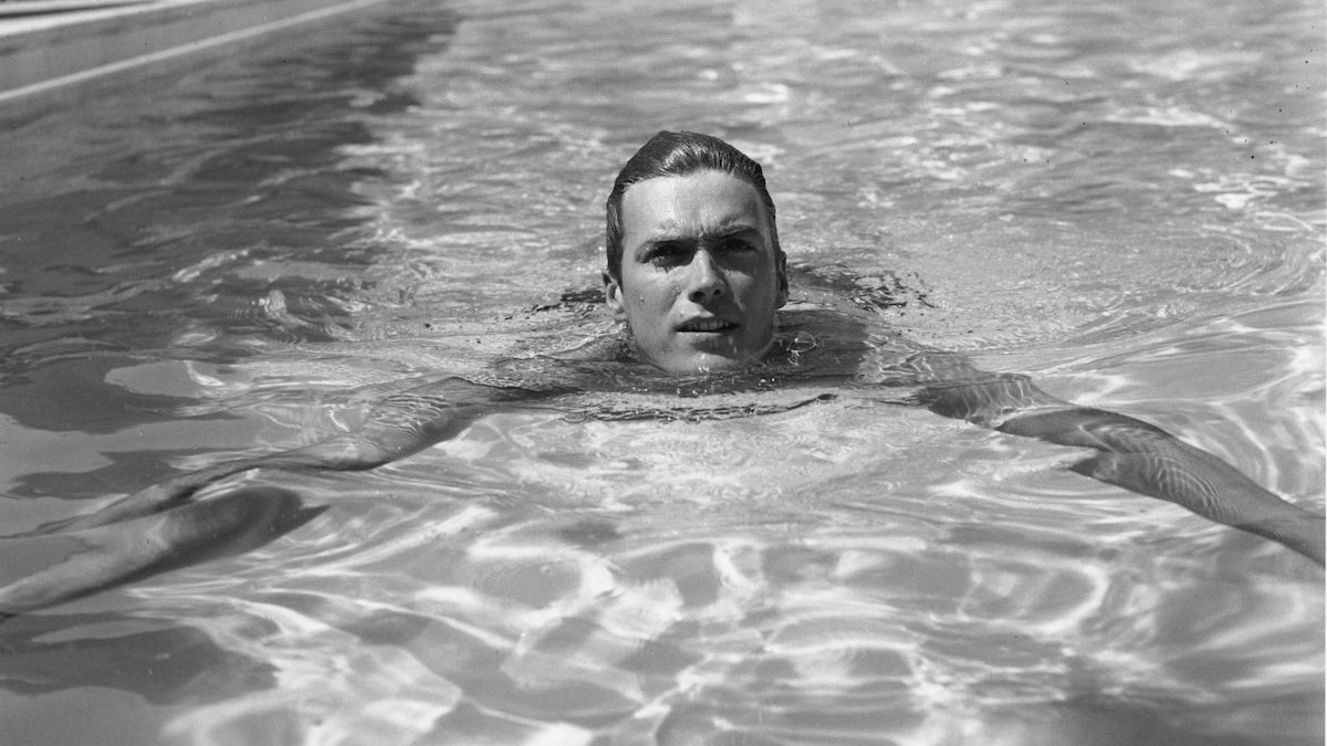 Young Clint Eastwood taking a swim, 1956