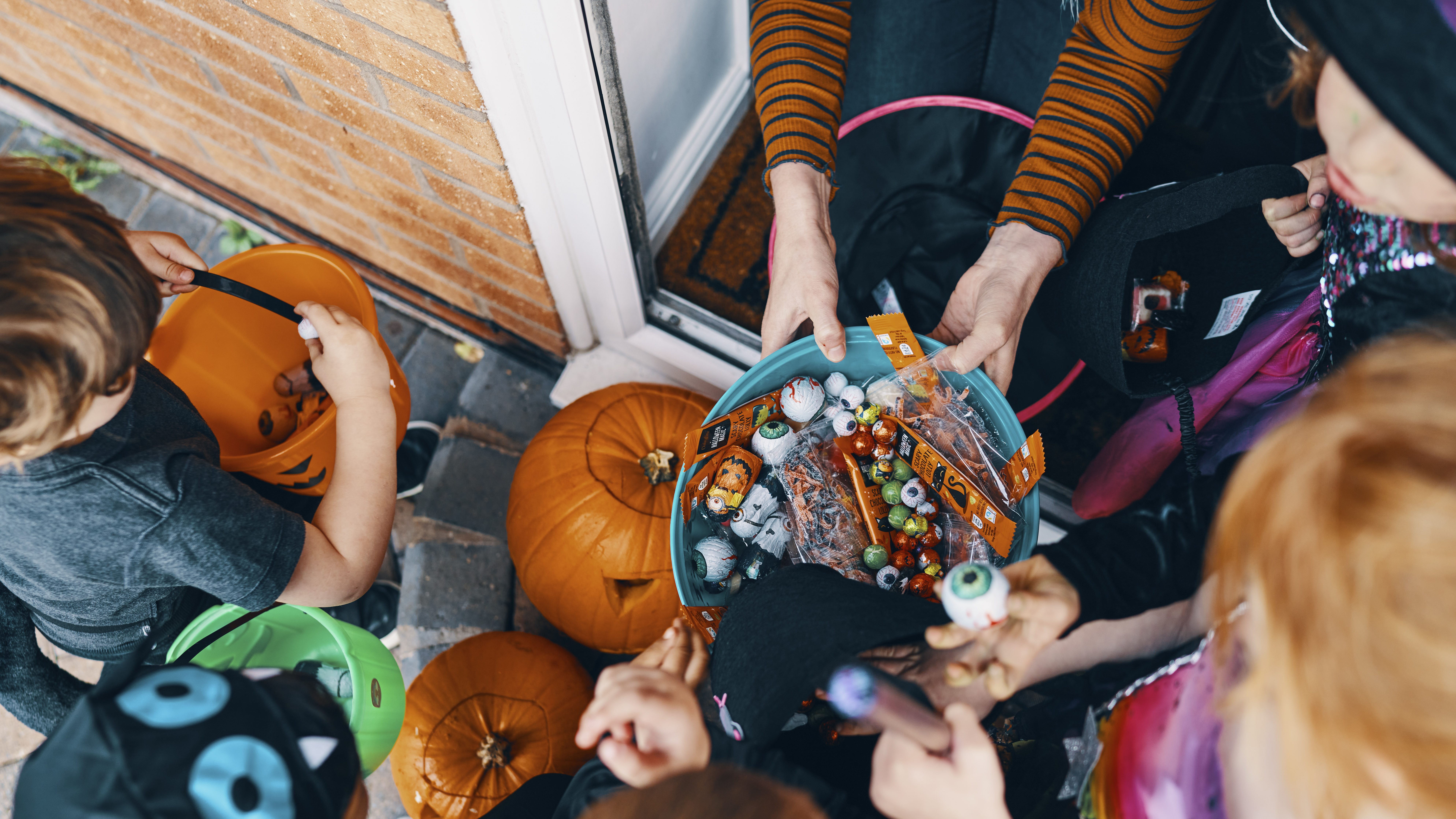 Trick-or-treaters gathering candy