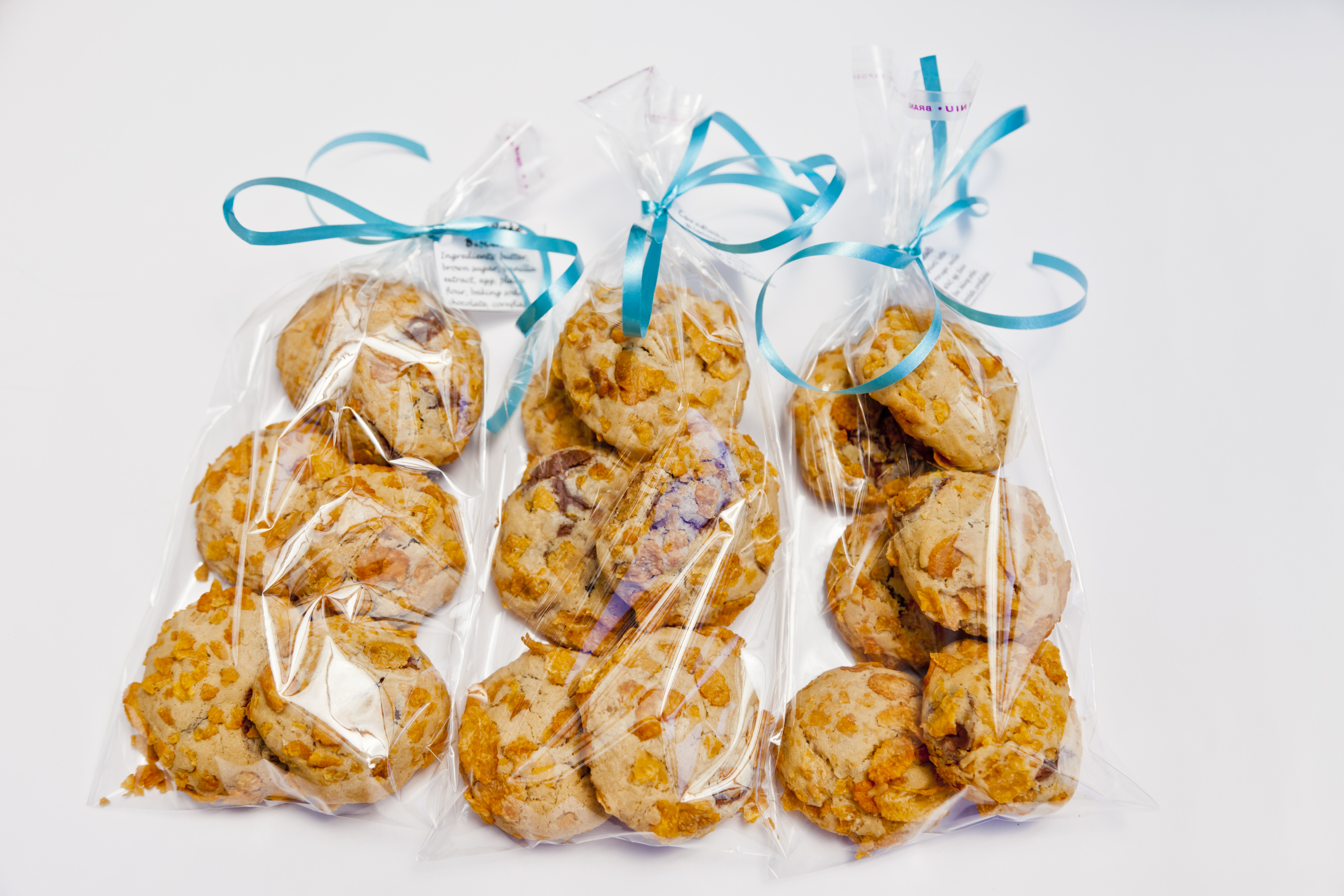 Close-up of packages of home-baked biscuits tied with a bow.