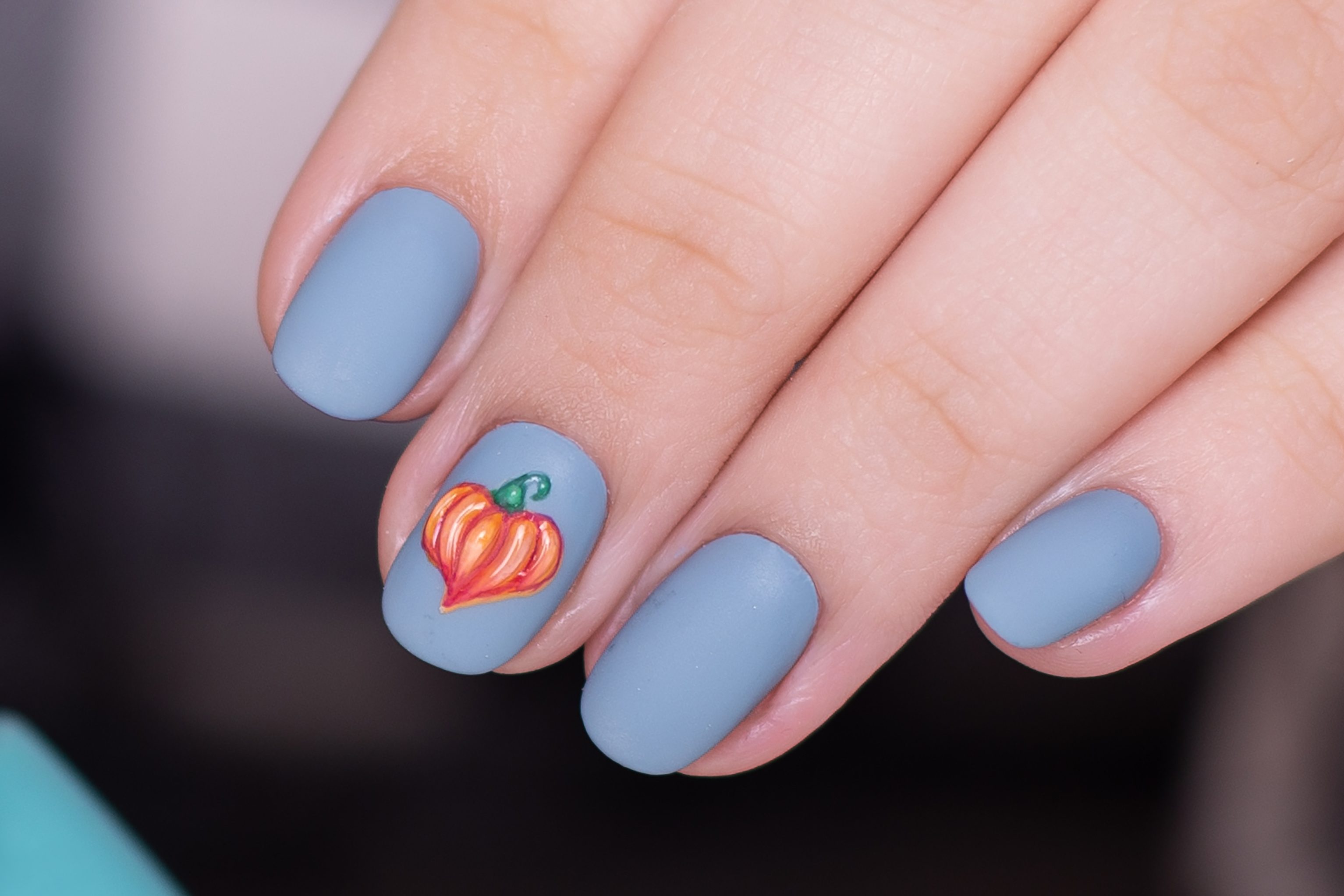 Dusty blue nails with pumpkin design