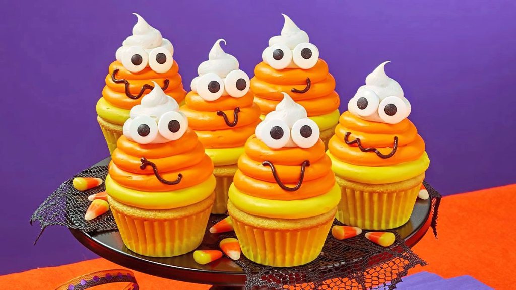 Jolly Candy Corn Cupcakes sit on a plate (scary cupcakes)