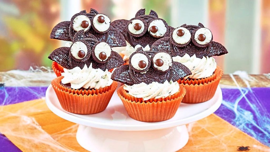 Batty Cookies ‘n’ Cream Cupcakes sits on a table (scary cupcakes)