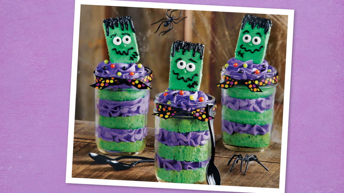 Frankenstein Cupcakes in Jars sits next to a spoon (halloween cupcakes)