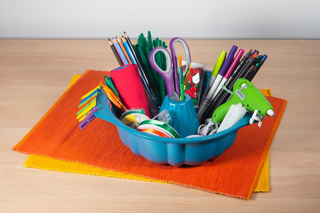 Bundt pan being used to hold art supplies