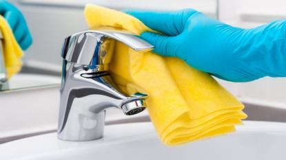 How to Clean Faucet Head link this shiny one with a yellow towel on it.