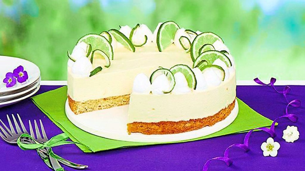 Coconut-Crusted Key Lime Cheesecake sits on a plate (coconut desserts)