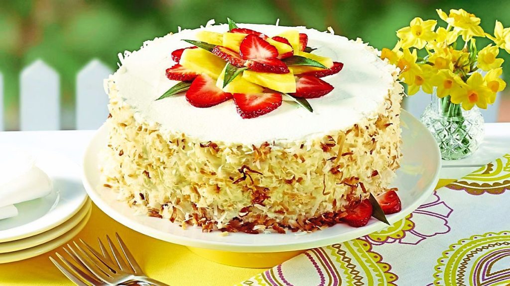 Tropical Strawberry Cake sits next to a lot of yellow (coconut desserts)