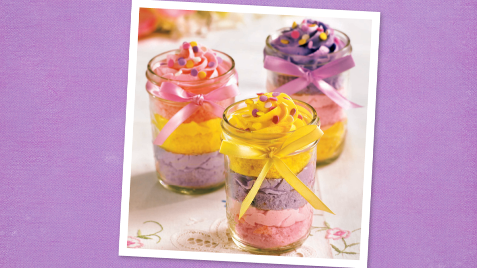 Pastel Cupcakes in Jars sits on a purple background (cake in jar)