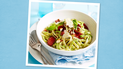 Fettucine with Herbed Pea Pesto sits on a blue background (Monday night dinner ideas )
