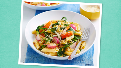 Veggie Penne with Toasted Breadcrumbs sits on a teal background (Monday night dinner ideas )