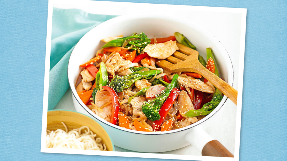 Gingery Chicken Stir-Fry sits on a blue background (Thin Sliced Chicken Breast Recipes)