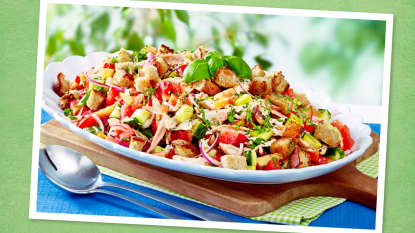 Herbed Panzanella Salad sits on a green background (Thin Sliced Chicken Breast Recipes)