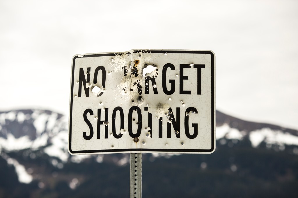 Funny signs: No target shooting sign riddled with bullet holes