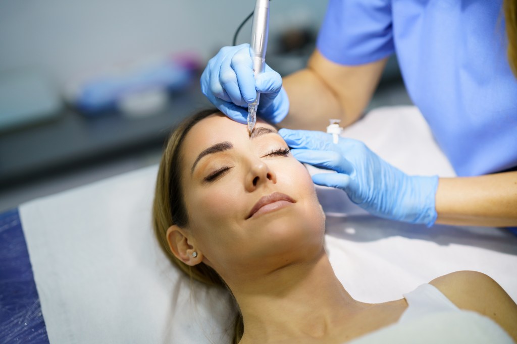 Mature woman getting microblading done