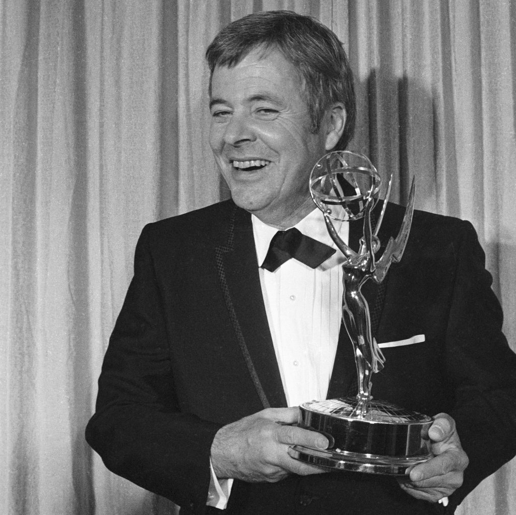 William Windom holds his Emmy Award for his role in My World and Welcome to It, 1970