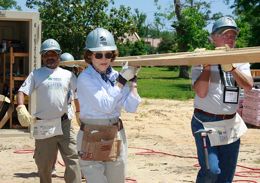 For more than three decades, President and Mrs. Carter led annual week-long Carter Work Projects for Habitat for Humanity, a nonprofit organization that helps to build and renovate homes for those in need. Rosalynn Carter is pictured here carrying a truss in Pascagoula, Miss., in 2008