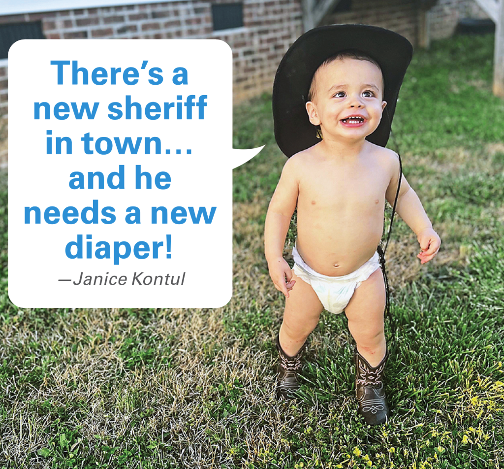 Caption Contest Winners: Baby in diaper and cowboy hat and boots with caption "There's a new sheroff in town…and he needs a new diaper!"