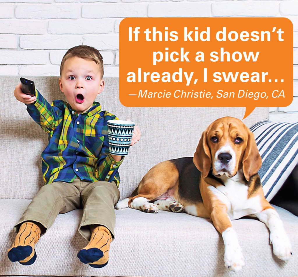 Caption contest winners: Boy on couch with remote next to dog on couch looking unamused with caption "If this kid doesn't pick a show already, I swear…"