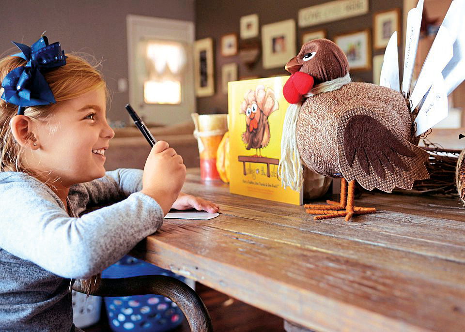 Girl smiling at the turkey