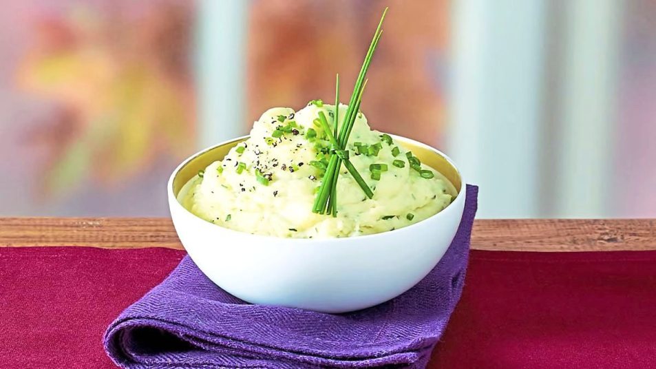 Slow-Cooker Buttermilk Herb Mashed Potatoes sits on a table (Side dishes for meatloaf)