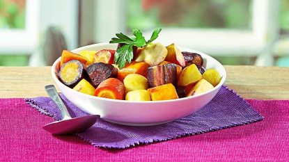 Rainbow Roasted Root Vegetables sits in a bowl (Side dishes for meatloaf)