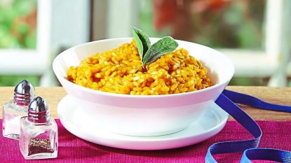 Creamy Pumpkin-Sage Risotto sits in a bowl (Side dishes for meatloaf)