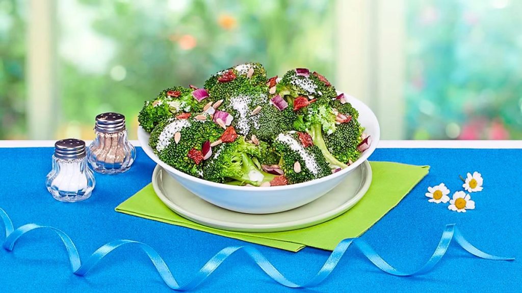 Broccoli and Bacon Toss sits on a blue table (Side dishes for meatloaf)