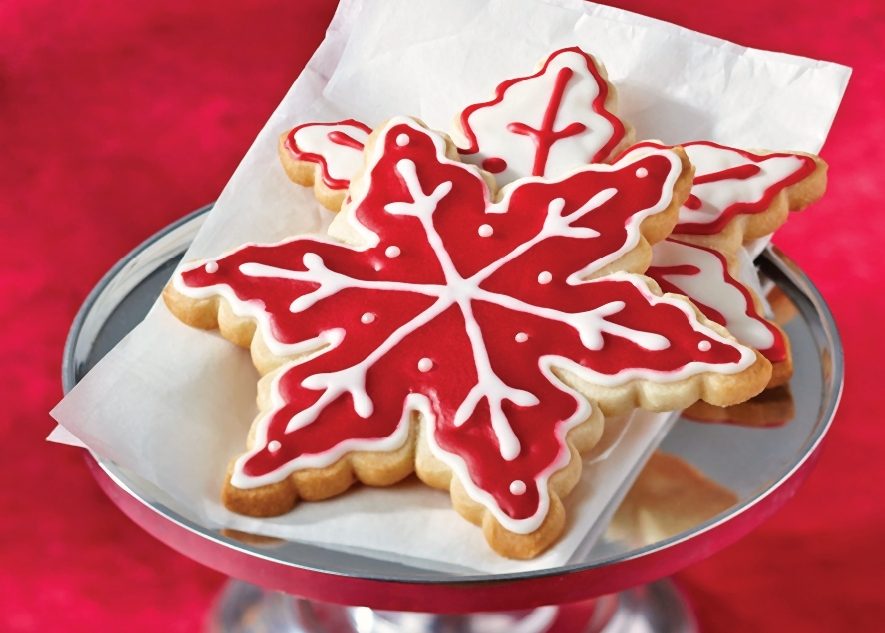 almond snowflakes recipe: sugar cookies on plate