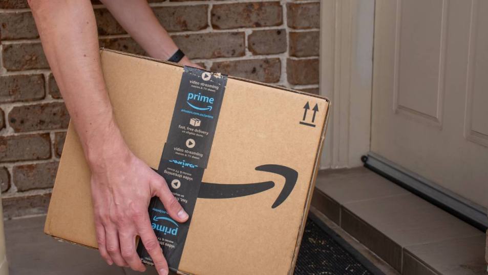 amazon package stolen: Amazon prime box delivered to a front door of residential building
