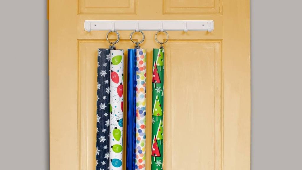 rolls of wrapping paper hanging up with shower curtain clips