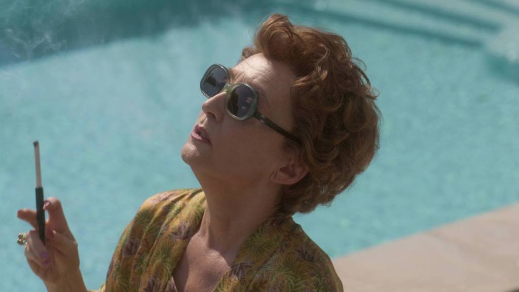 Woman holding a cigarette by a pool The Crown Final Season part 2