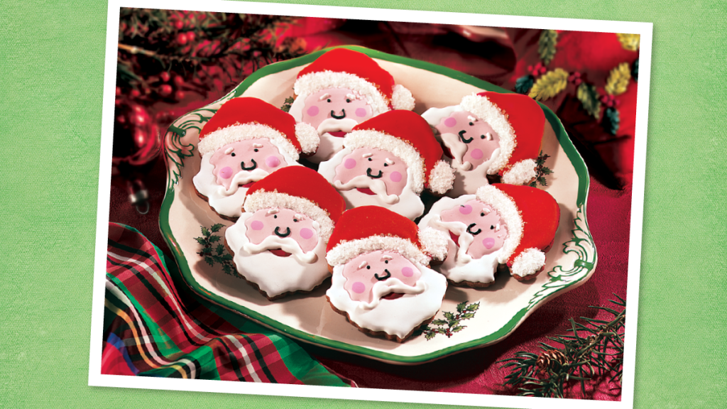 Gingerbread cookies decorated to look like Santa