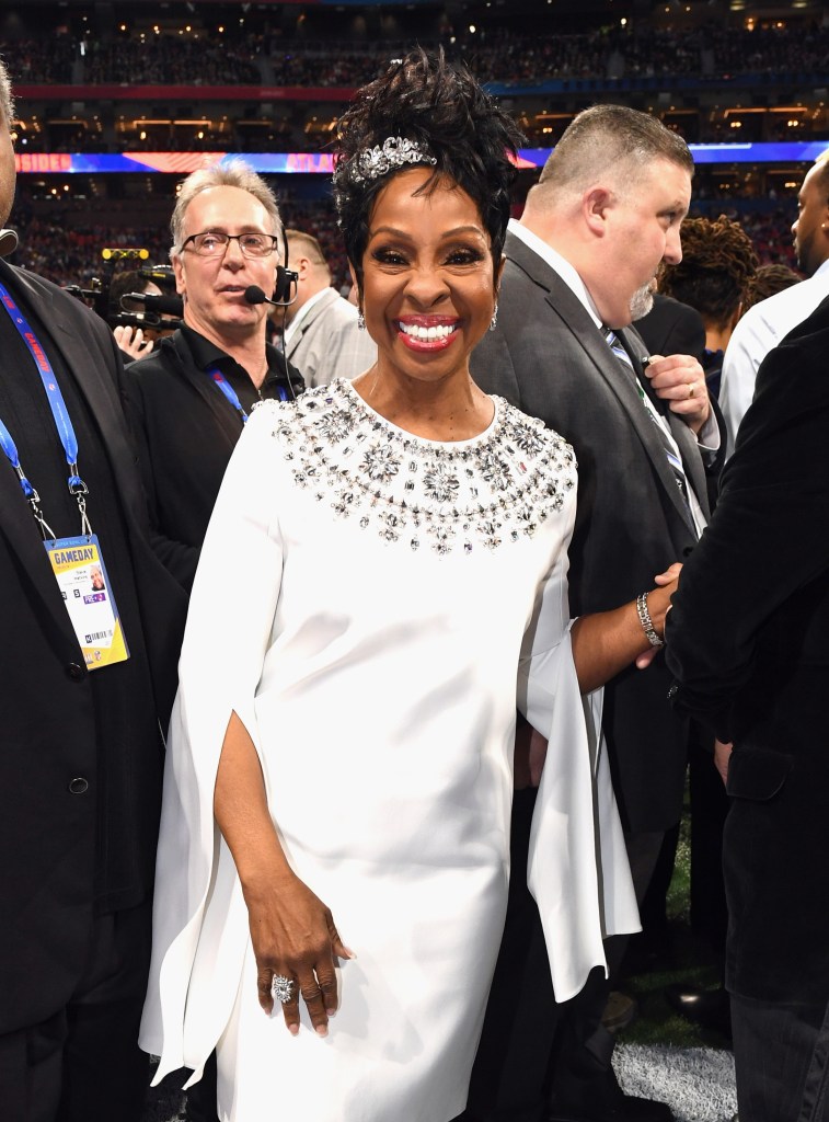 ATLANTA, GA - FEBRUARY 03:  Gladys Knight attends the Super Bowl LIII Pregame at Mercedes-Benz Stadium on February 3, 2019 in Atlanta, Georgia wearing a white dress and rhinestone-encrusted clip in her hair that's styled in an updo