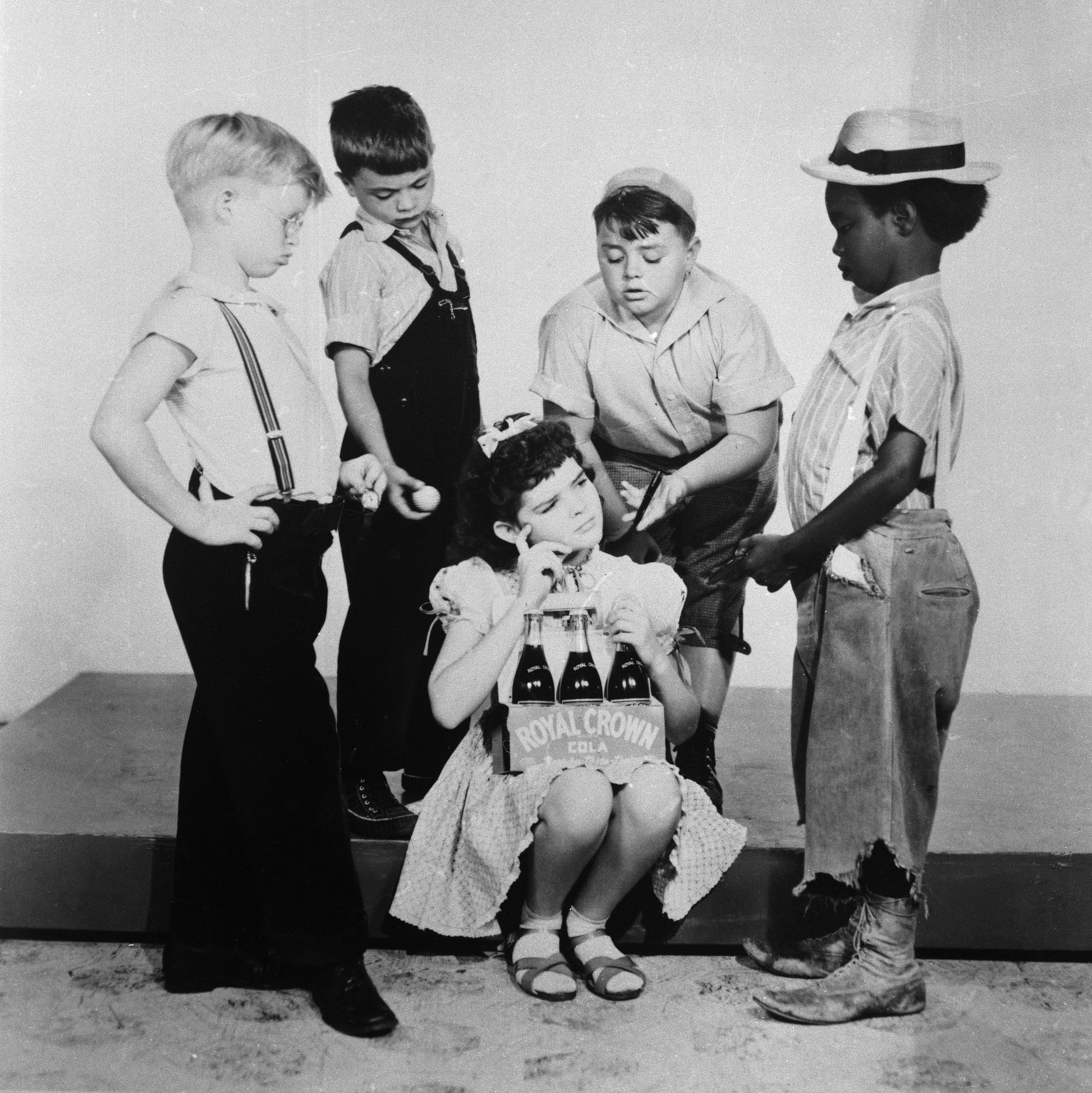 Darla Hood sits in the middle of The Little Rascals group, 1940  