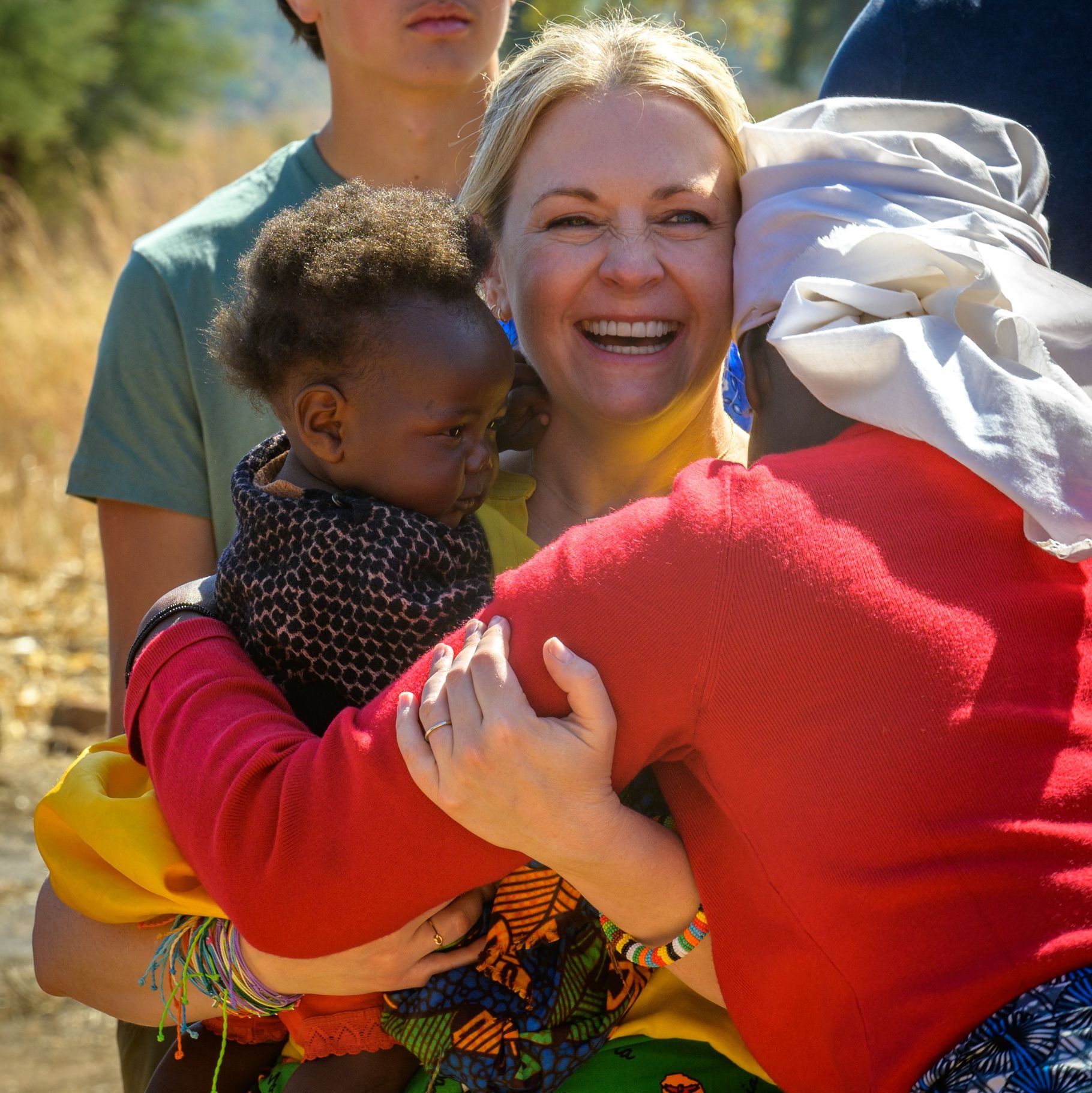 Melissa Joan Hart holds child in Zambia, 2023